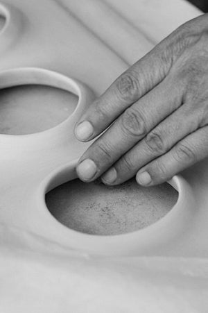 Hand touching ceramic art